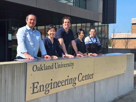 OU faculty members in front of Engineering Center