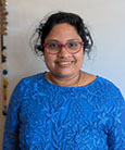 Uma Pandalai smiling at the camera