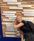 Kayla Zelda pointing to writing on a wall