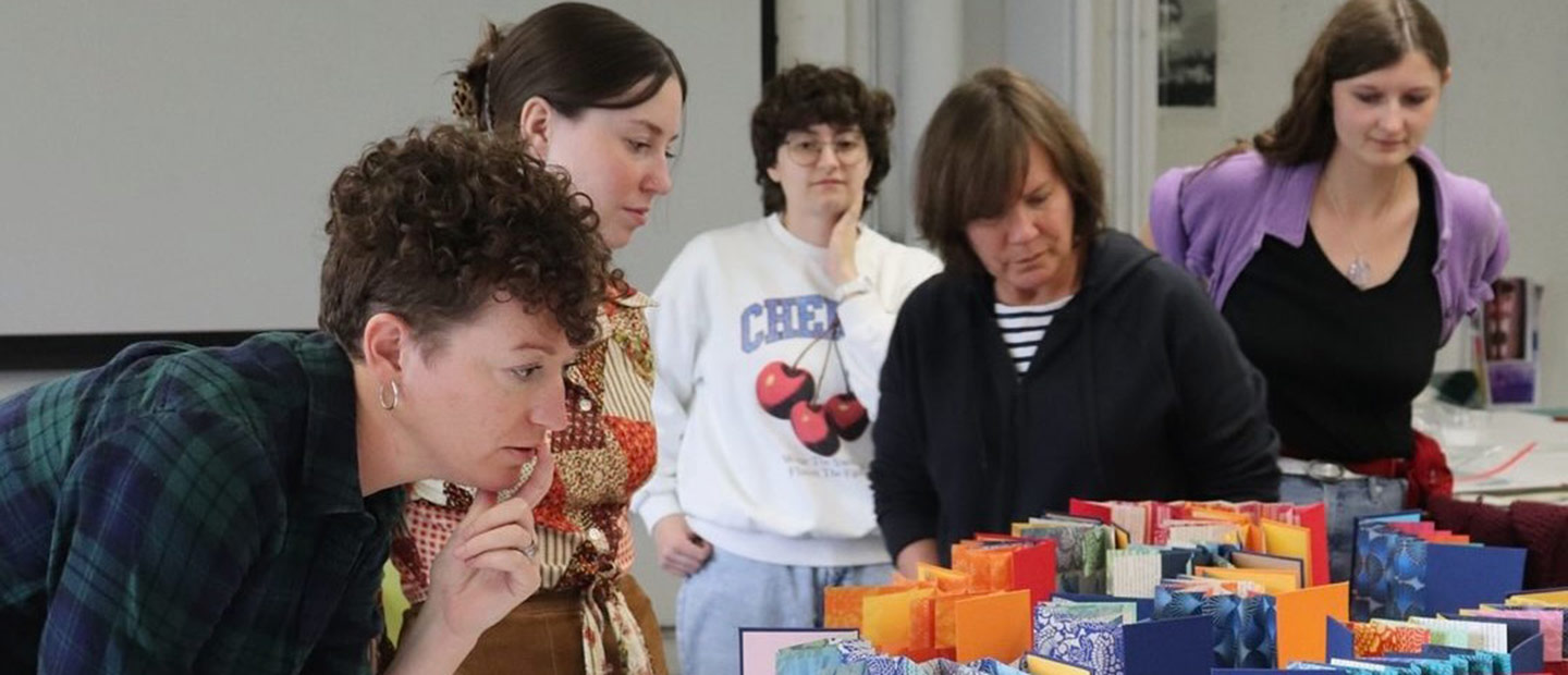 People at a bookmaking workshop