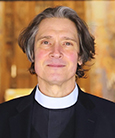 Rev Dr William J Danaher poses for a photo.