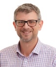 A headshot of Charles Guzowski
