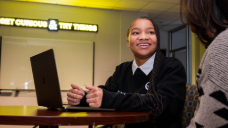 Lashonda Echols seated with a laptop