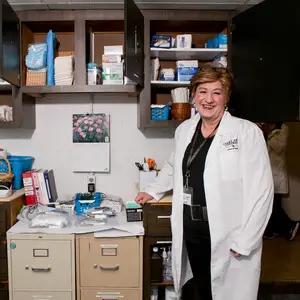 Judith Fouladbakhsh, Ph.D. in a medical office.