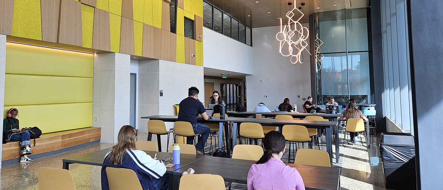 Student Resources Students seated in a common area in a building at Oakland University