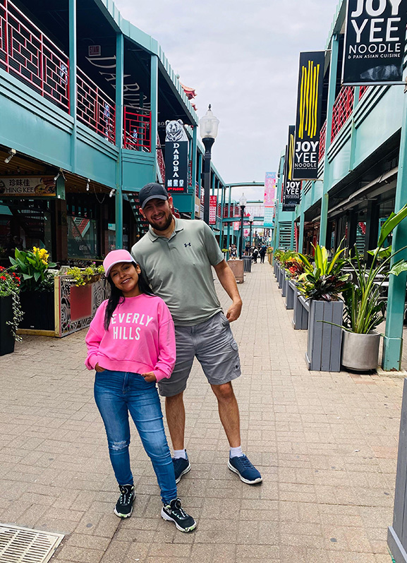 Joshua Hamann (right) and a woman pose for a photo.