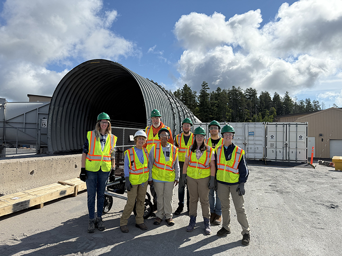 Oakland Environmental Science students stand in front of the portal to the Eagle Mine.