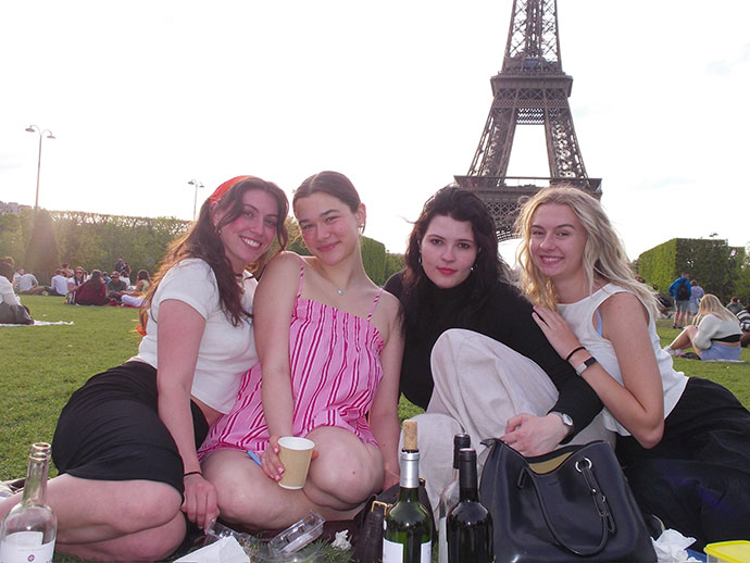 Mallory Waligora poses for a photo in Paris with three other students.