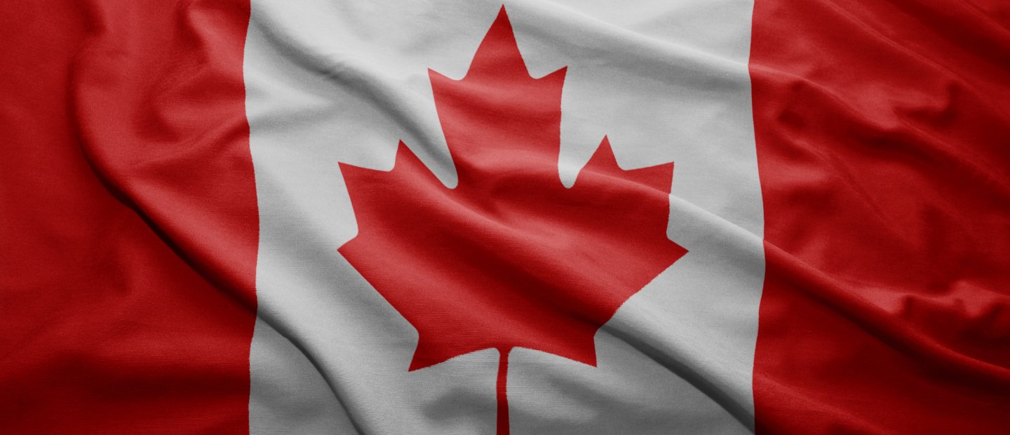 Canadian flag, red maple leaf centered on a white background with red section to the left and right