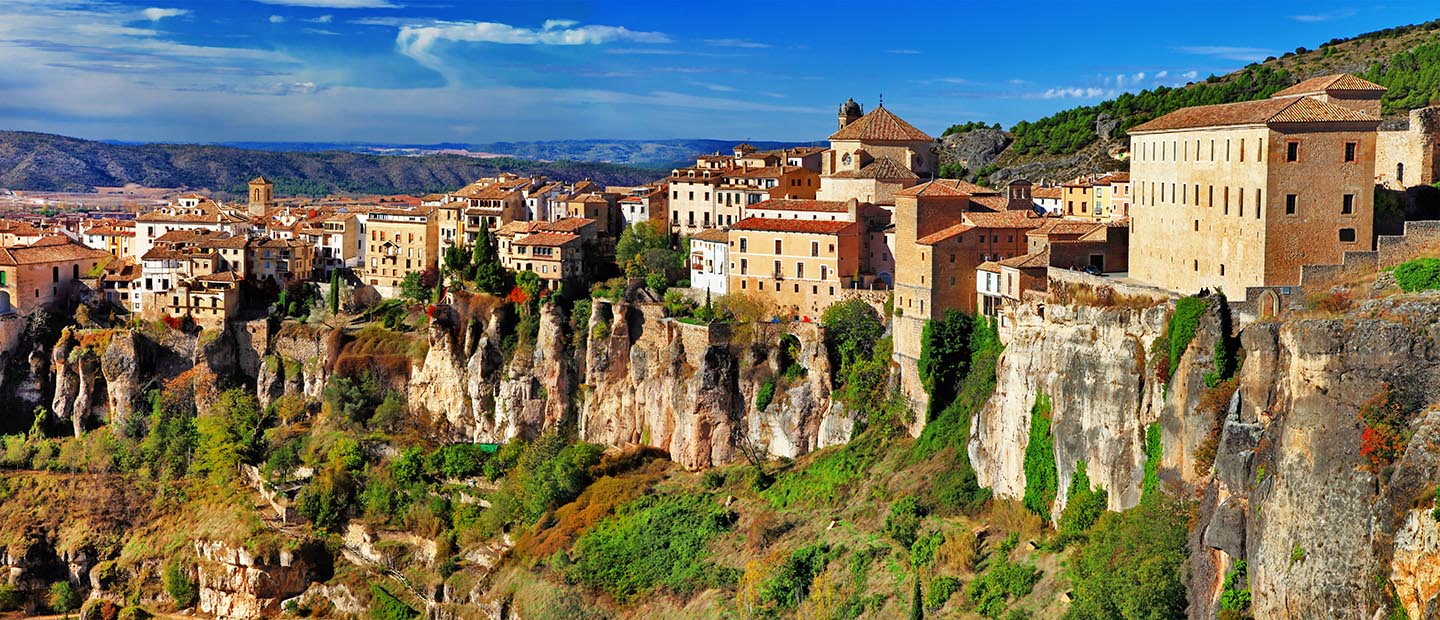 Town in Spain sitting on the ledge of a cliff