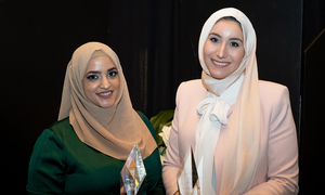 Two OUWB alumni pose for a photo