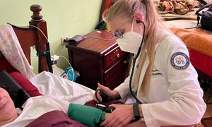 An OUWB student taking a blood pressure reading