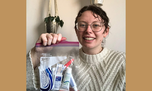 A student holds one of the kits