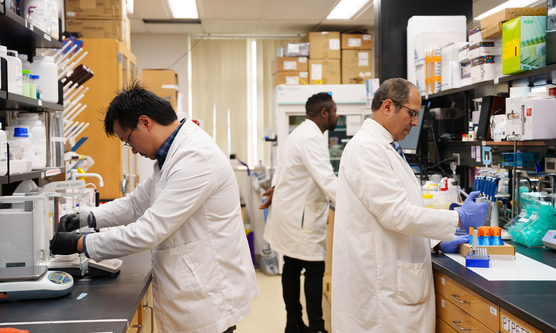 An image of the three researchers in a lab