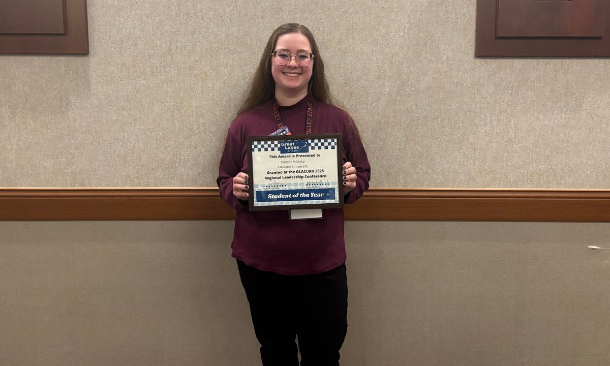 Natalie Ishioka holds a certificate