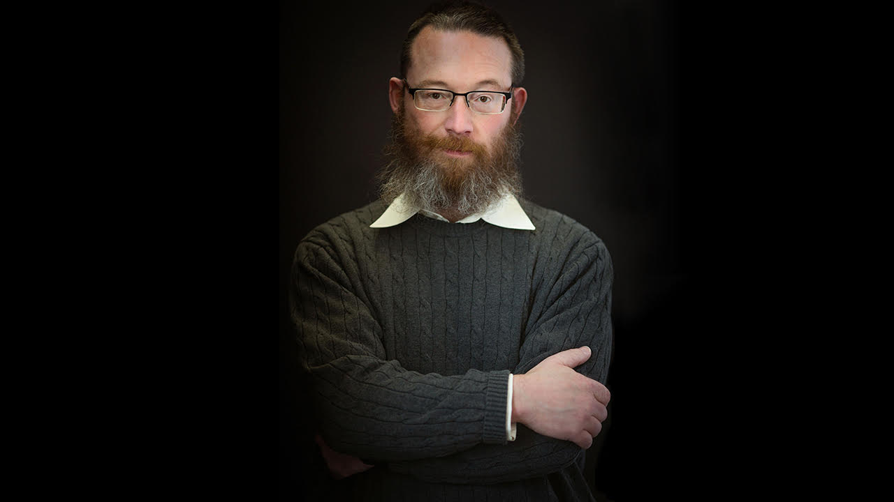 Todd Shackelford standing with arms crossed