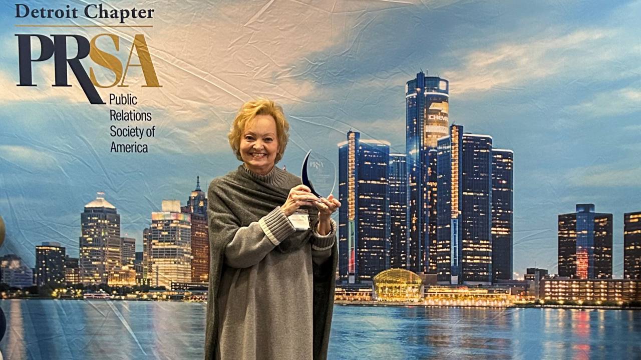 OU Professor Colleen Lafferty holding PRSA Award