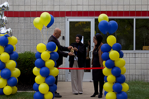 A ribbon cutting ceremony at the opening of The Nest