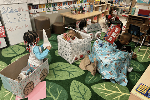 Students receiving gifts at Detroit Academy of Arts and Sciences