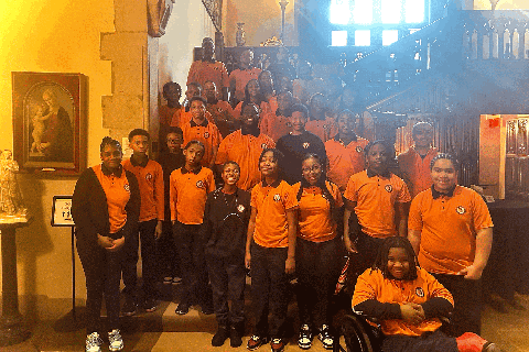 Weston Academy students posing for a group photo on stairs at Meadow Brook Hall