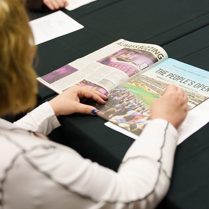 A woman looking at a magazine