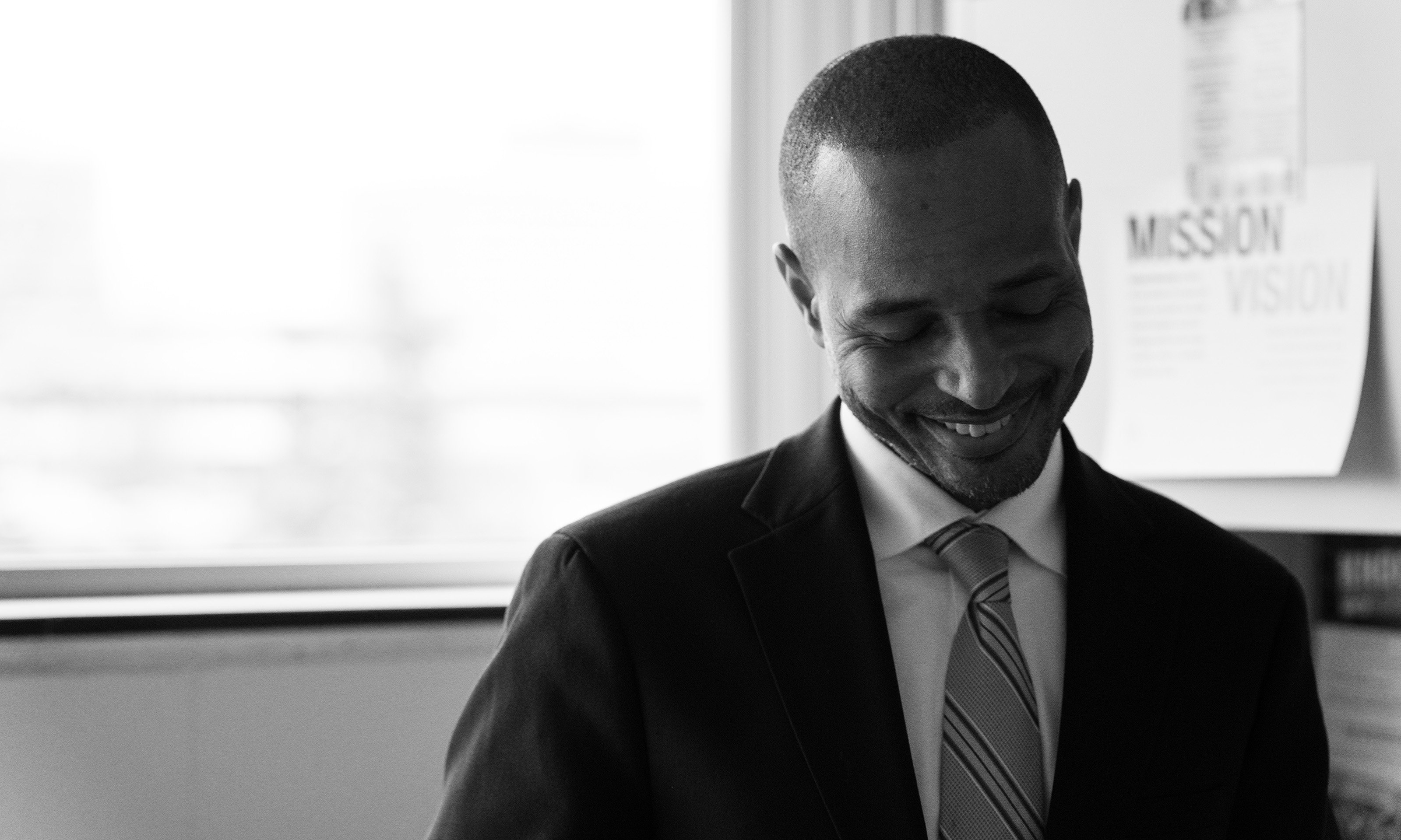 A man looking down and smiling