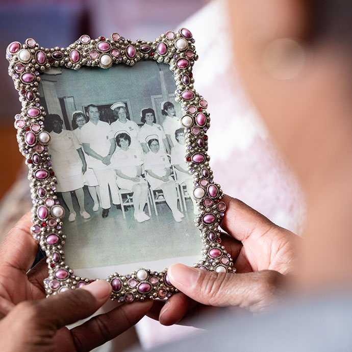 Woman holding black and white photo