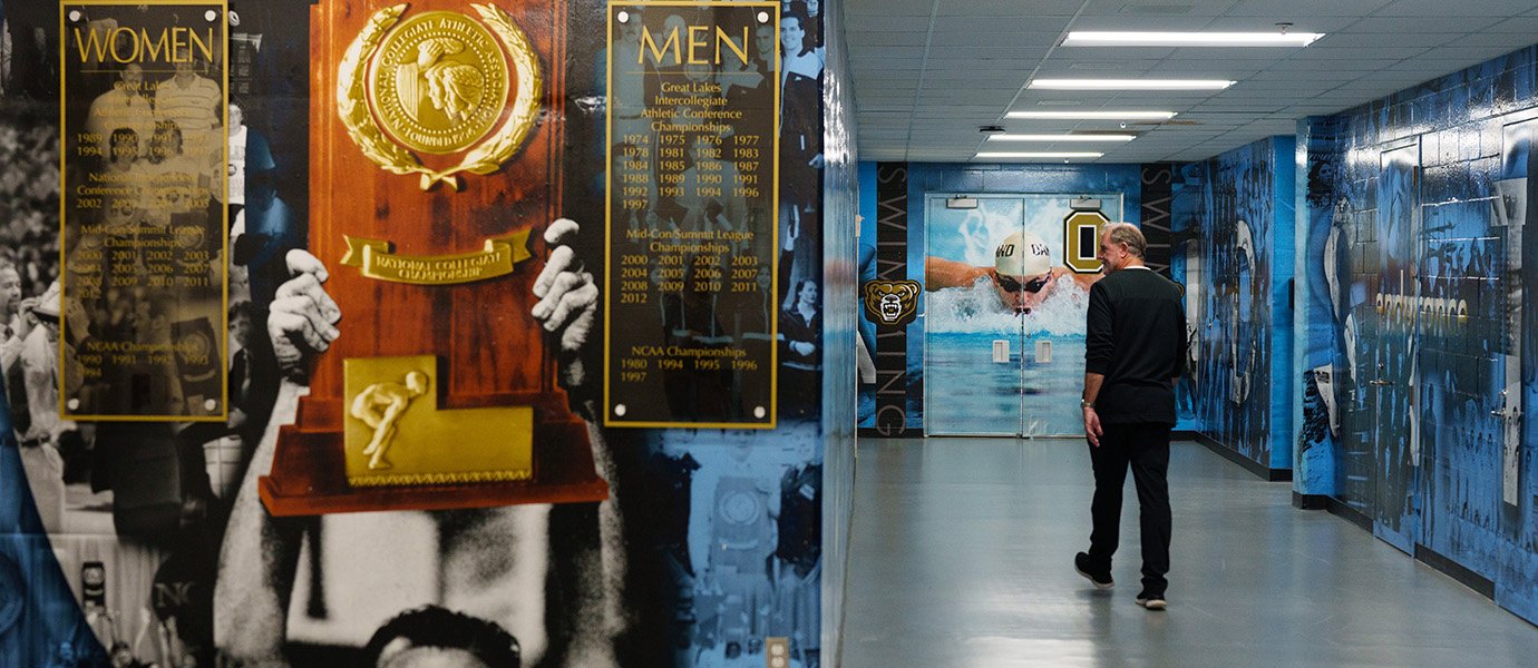 Man walking through hallway