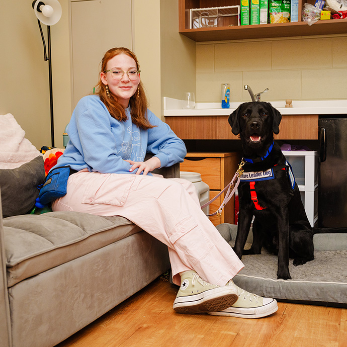 Person sitting with dog