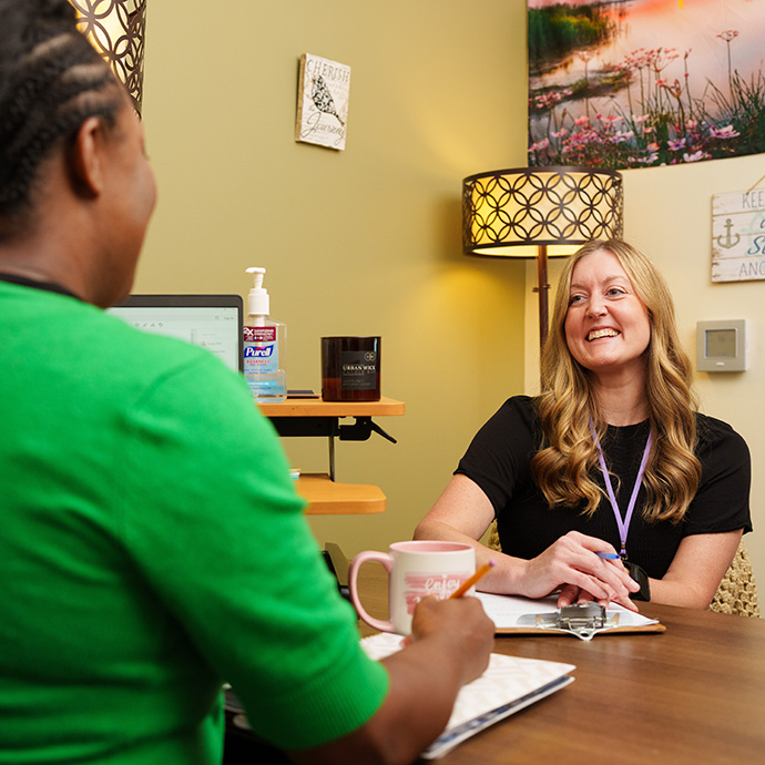 women talking in office