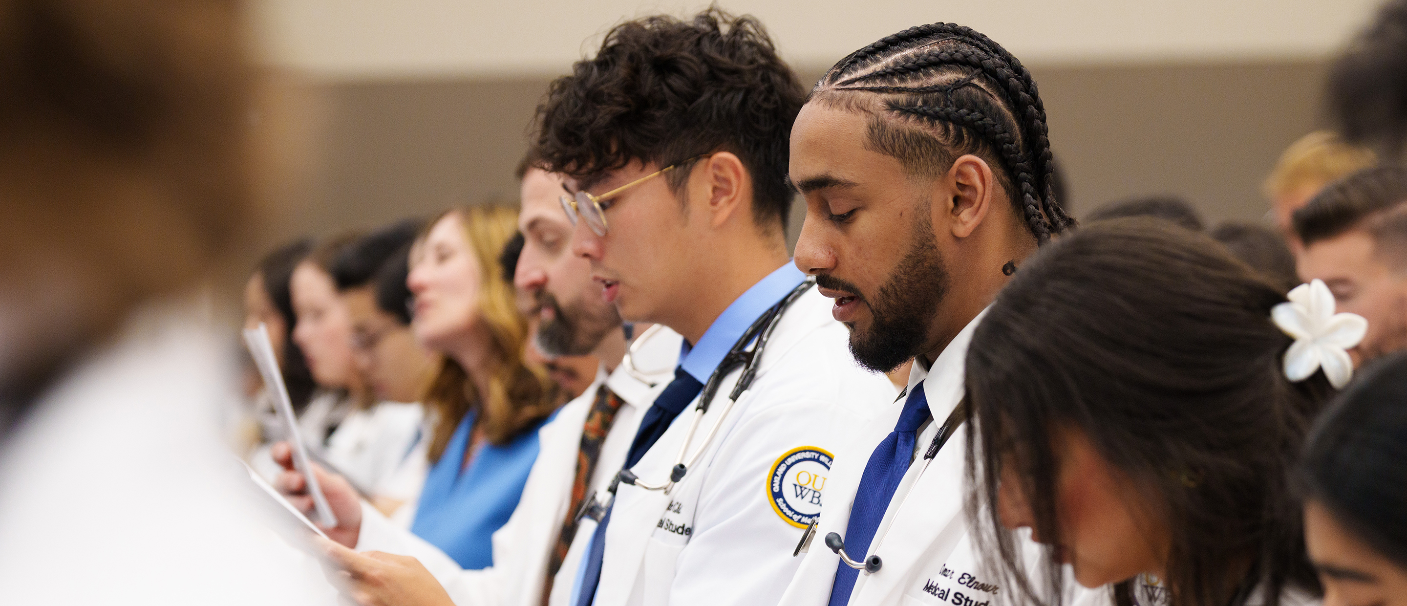 Application Process Banner An image of OUWB students at white coat