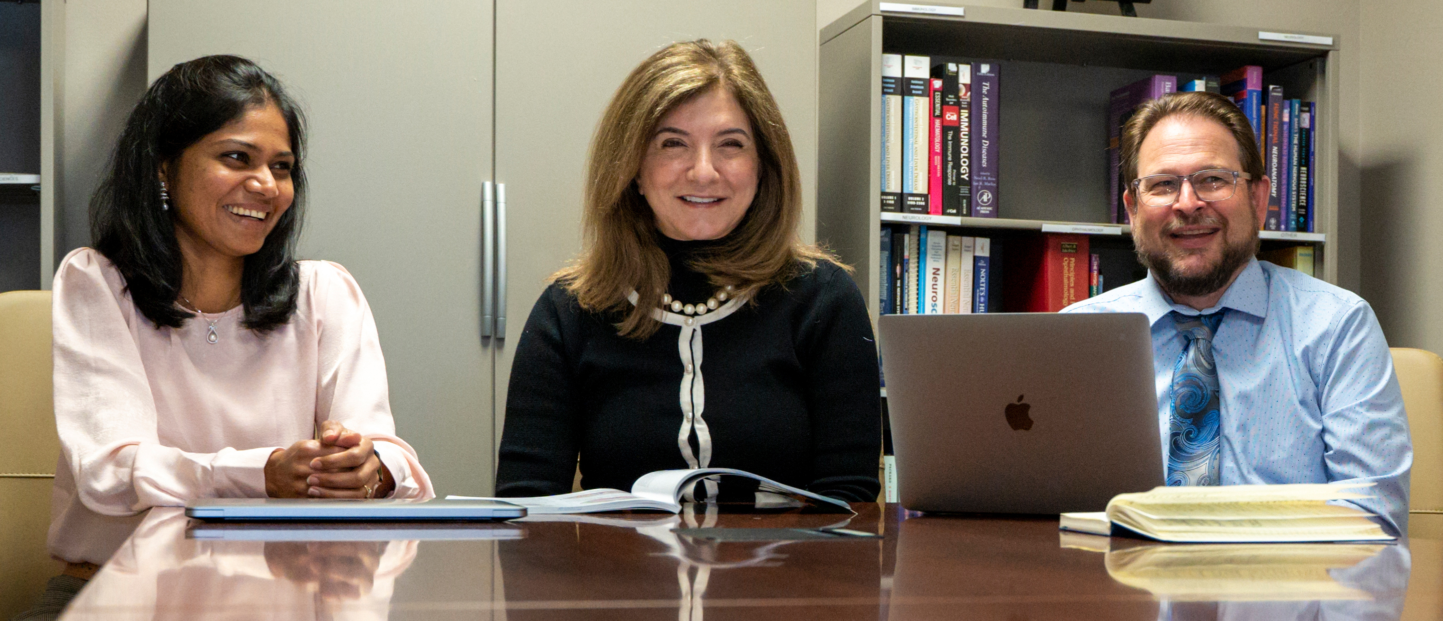 Faculty Governance Banner An image of OUWB faculty members sitting at a table