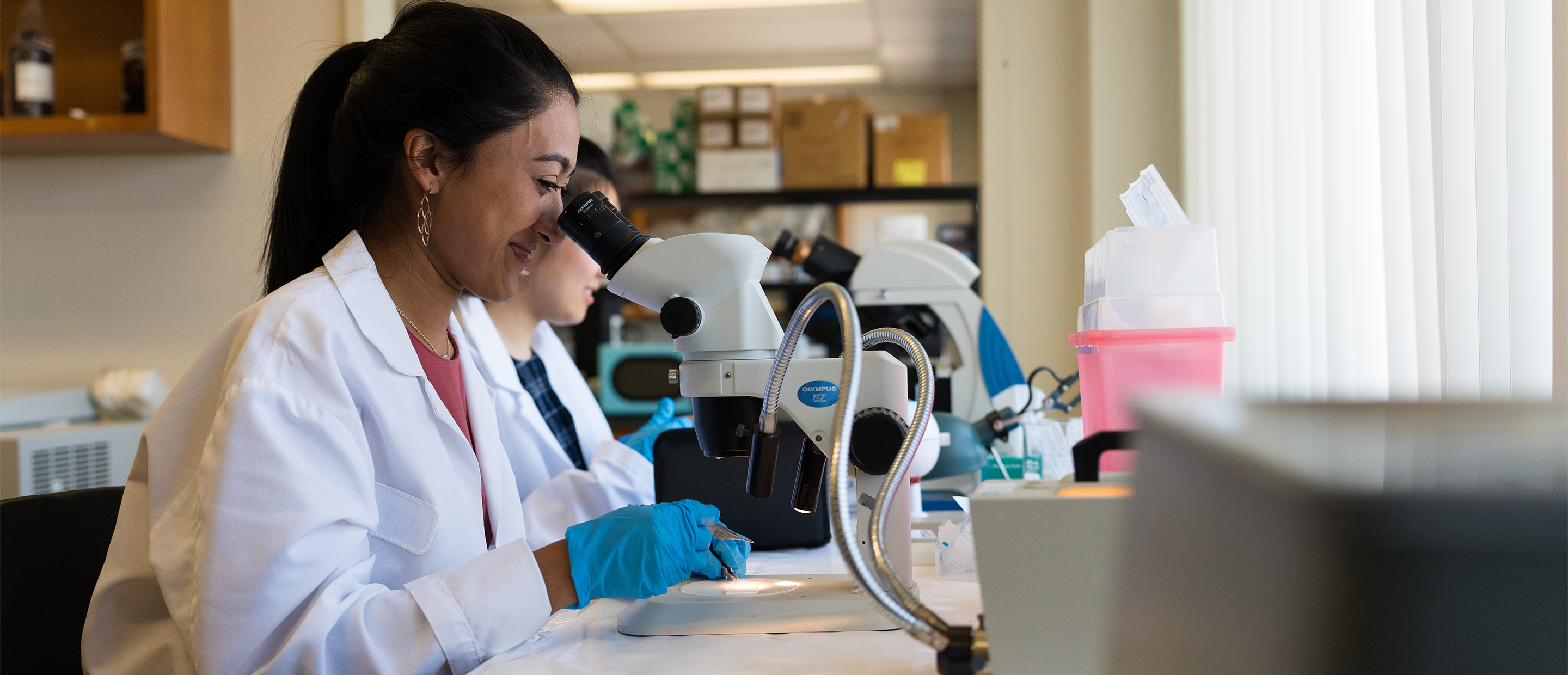 OUWB ERC Banner An image of a student at a microscope