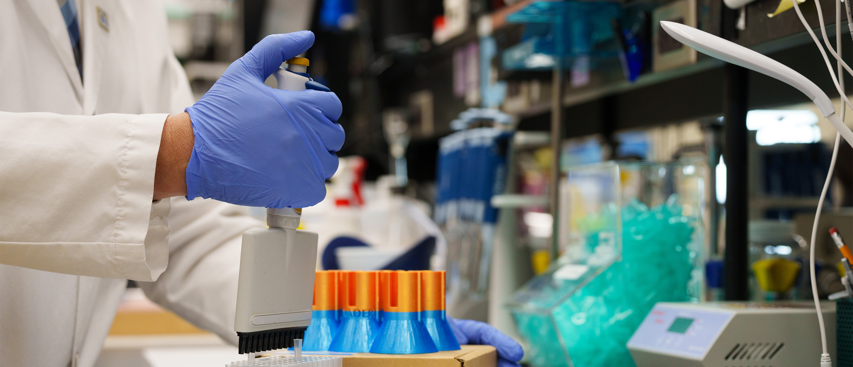 OUWB Research Banner An image of test tubes and a hand in a glove