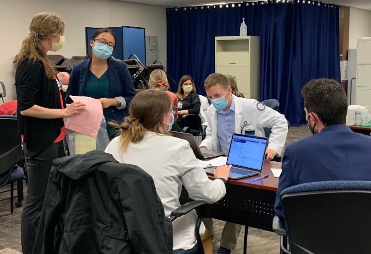 An image of students in a clinical setting