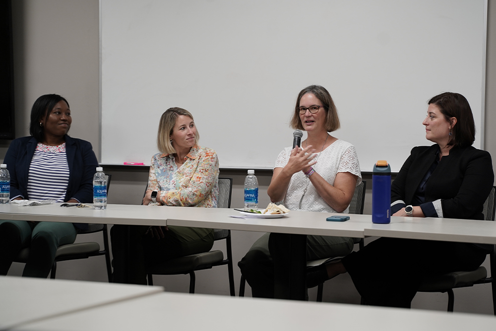 An image of the panel members speaking