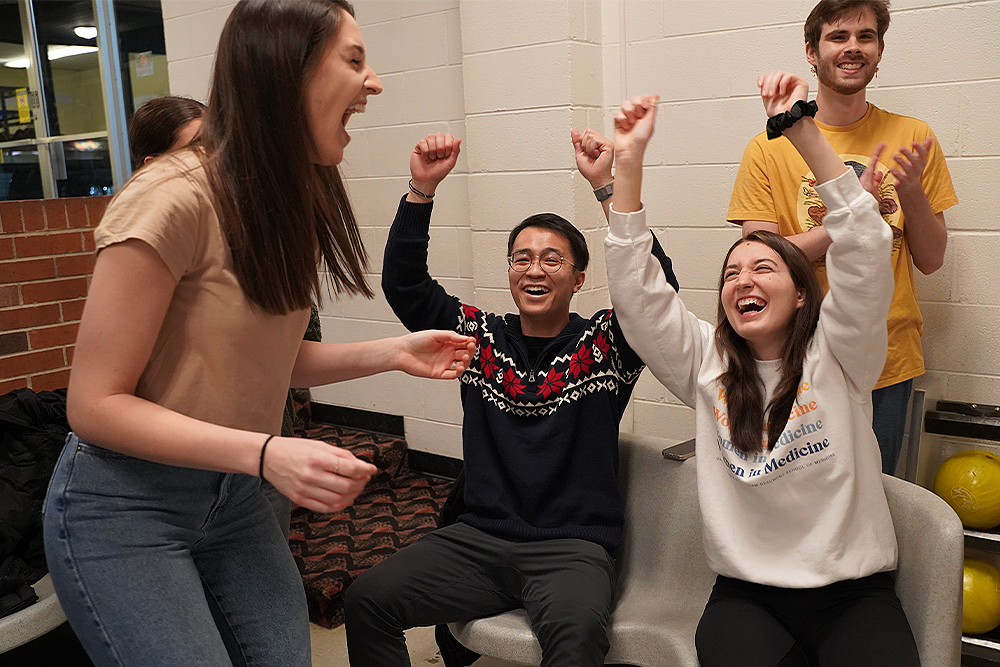 An image of students at the bowling fundraiser