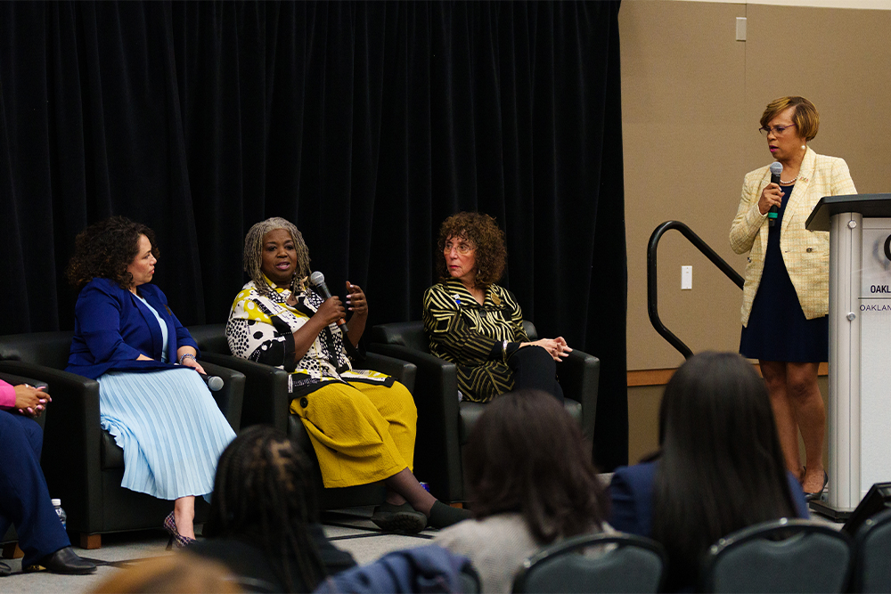 An image of Sophia Nelson talking with the panel