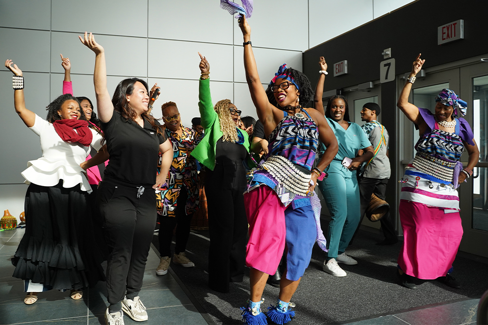 An image of the OUWB community dancing