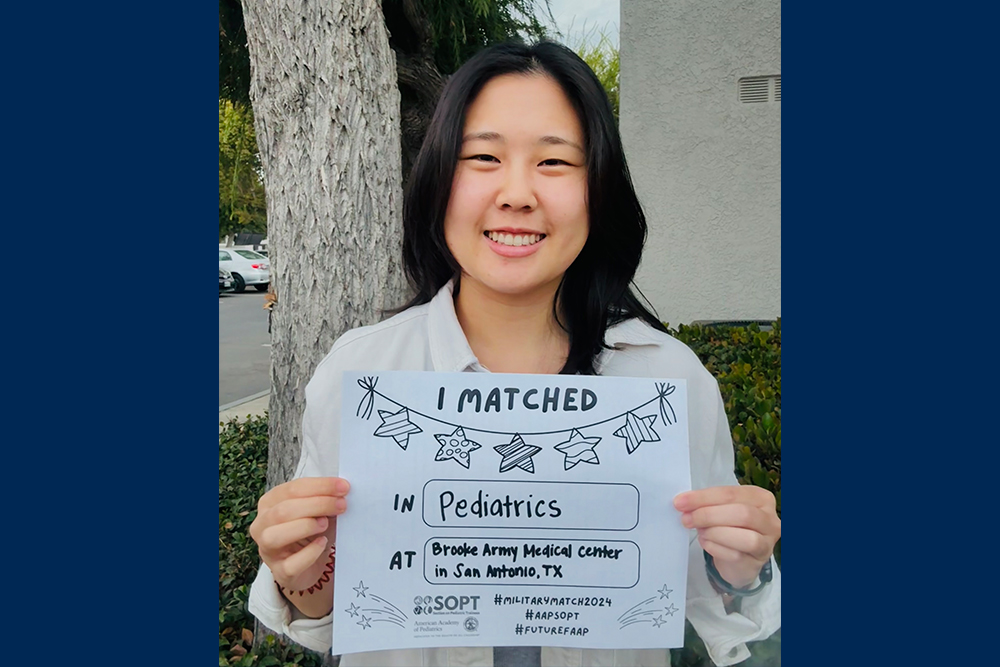 An image of Nikita Lee showing a sign where she matched