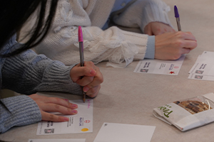 OUWB students writing postcards