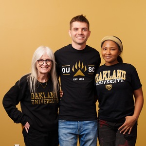 Three Oakland University students posing for a photo together