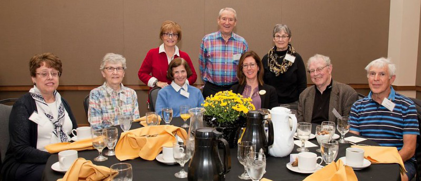 Events A group of Pioneer Club members posing for a photo at a banquet
