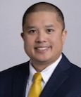 Trung Nguyen smiling at the camera