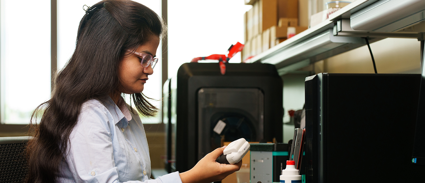 A young woman working with electrical equipment