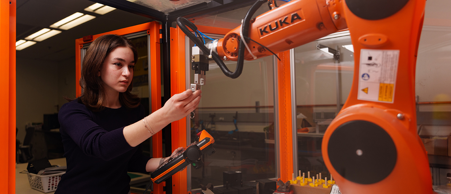 A woman working with industrial equipment