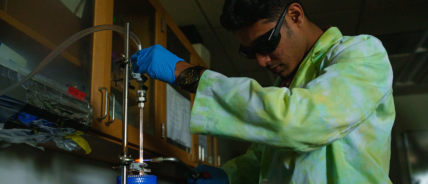 A young man working in a science lab