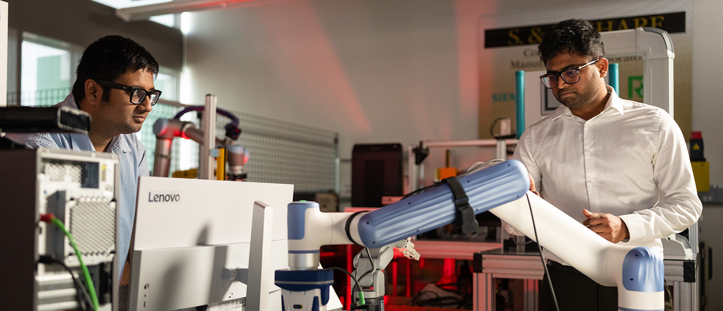 Two men working in a manufacturing lab