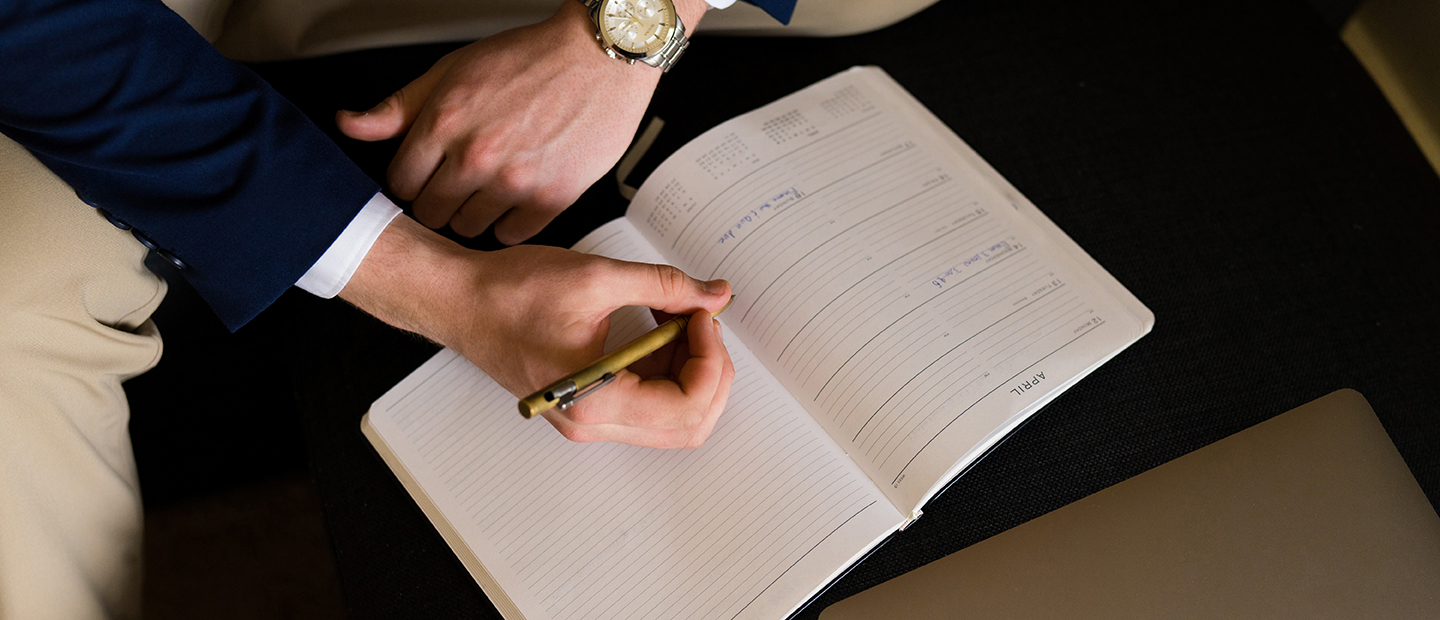 Careers and Internships Hands writing in a notebook