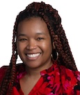 Whitney Davis smiling at the camera